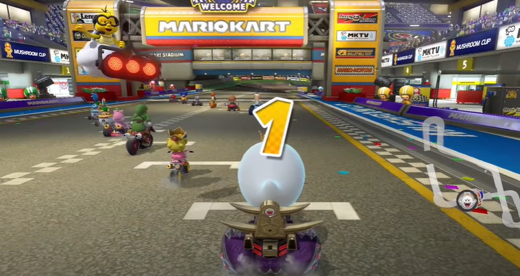 how to hold items behind you in mario kart