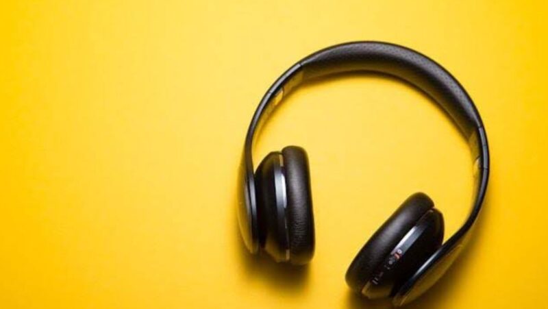 Headphones on a yellow surface